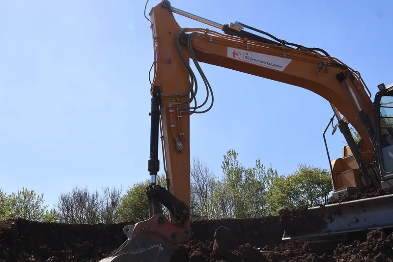 Excavator digging on a groundworks site
