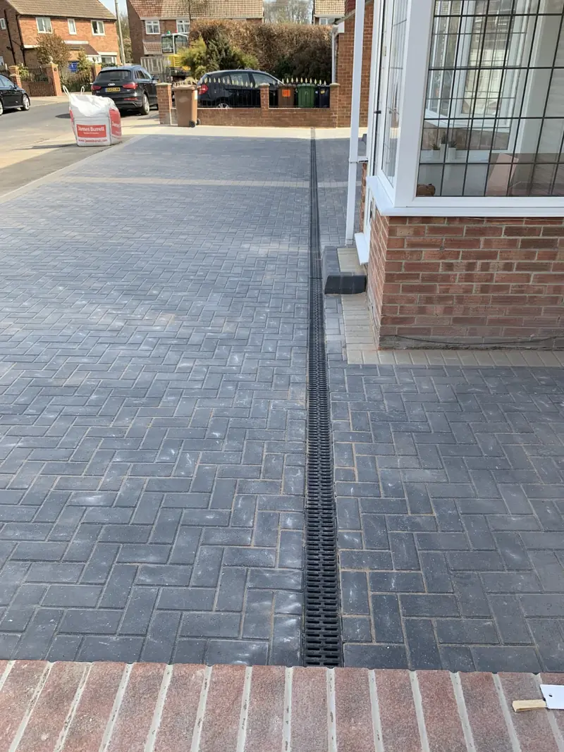 Block paved driveway with channel drain