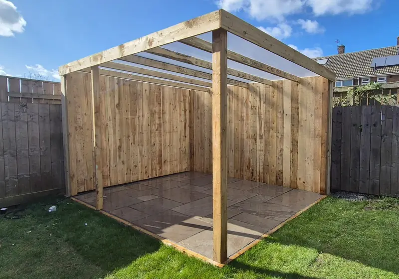 Timber gazebo on a paved base